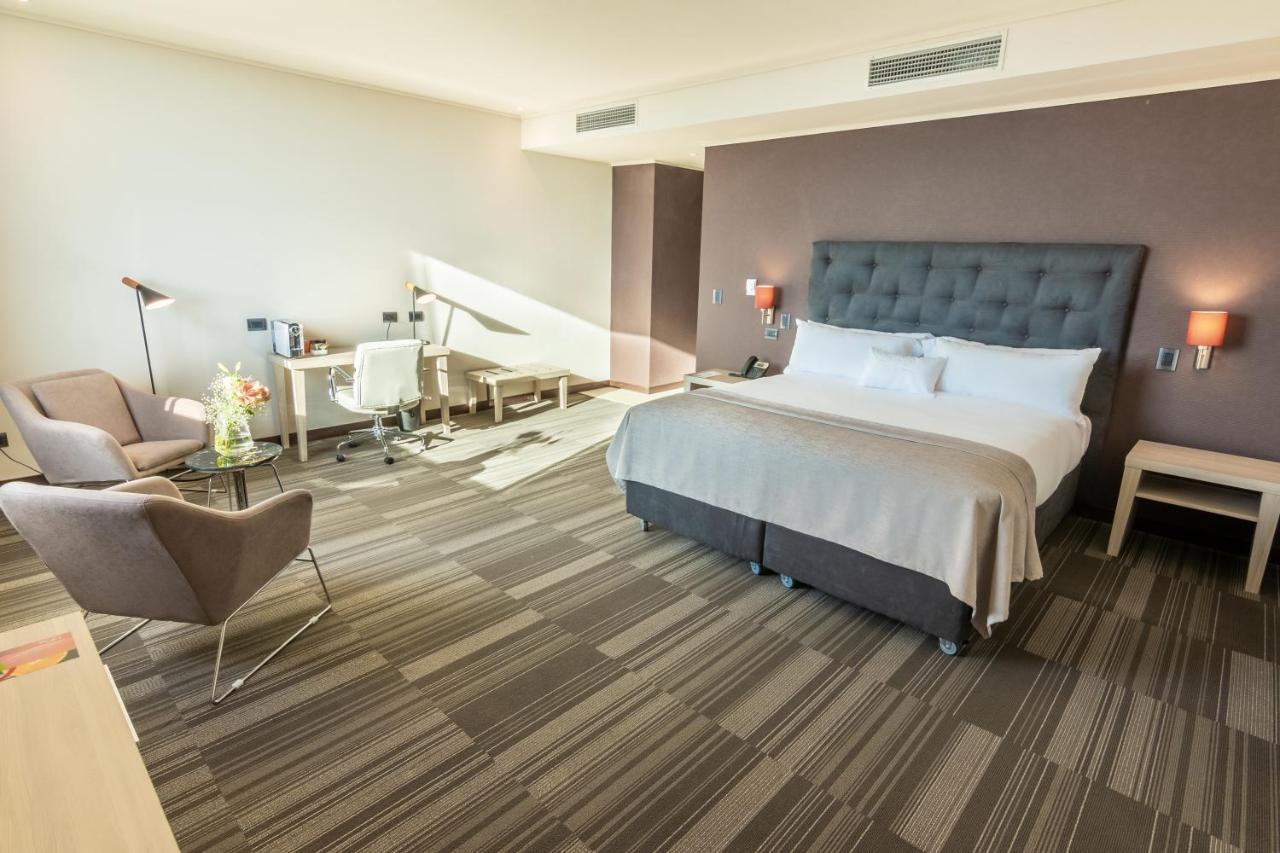Mds Hotel Chillan Bagian luar foto A room at the hotel